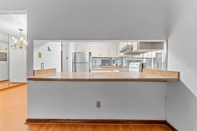 a living room with granite countertop furniture and chandelier