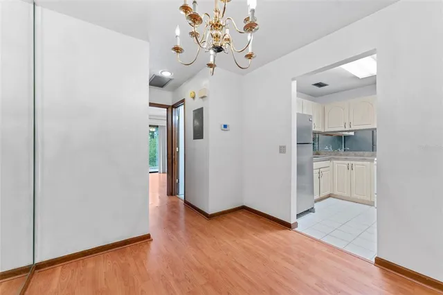 a view of a kitchen with wooden floor