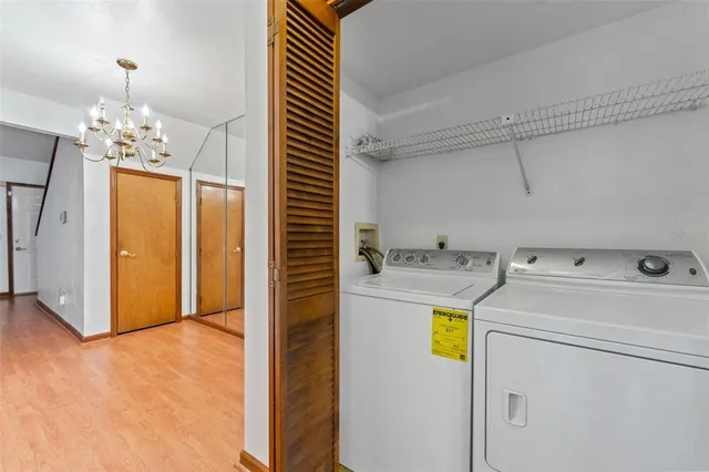 a view of a storage & utility room with washer and dryer