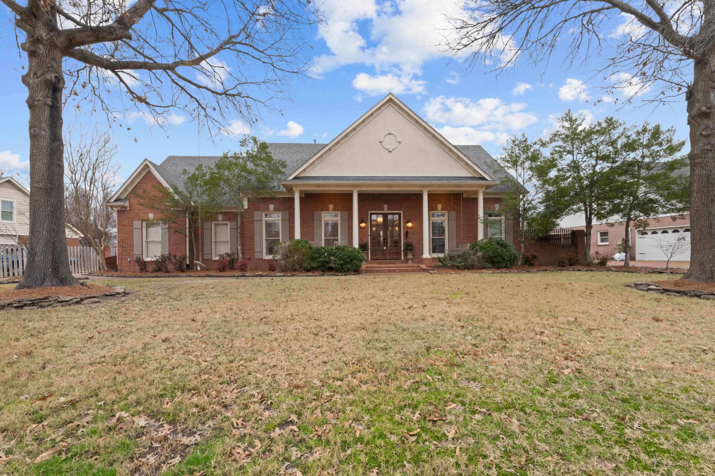 1594 John Ridge Drive Collierville, TN 38017 - Photo 1 of 29 View of front of house featuring a porch and a front yard