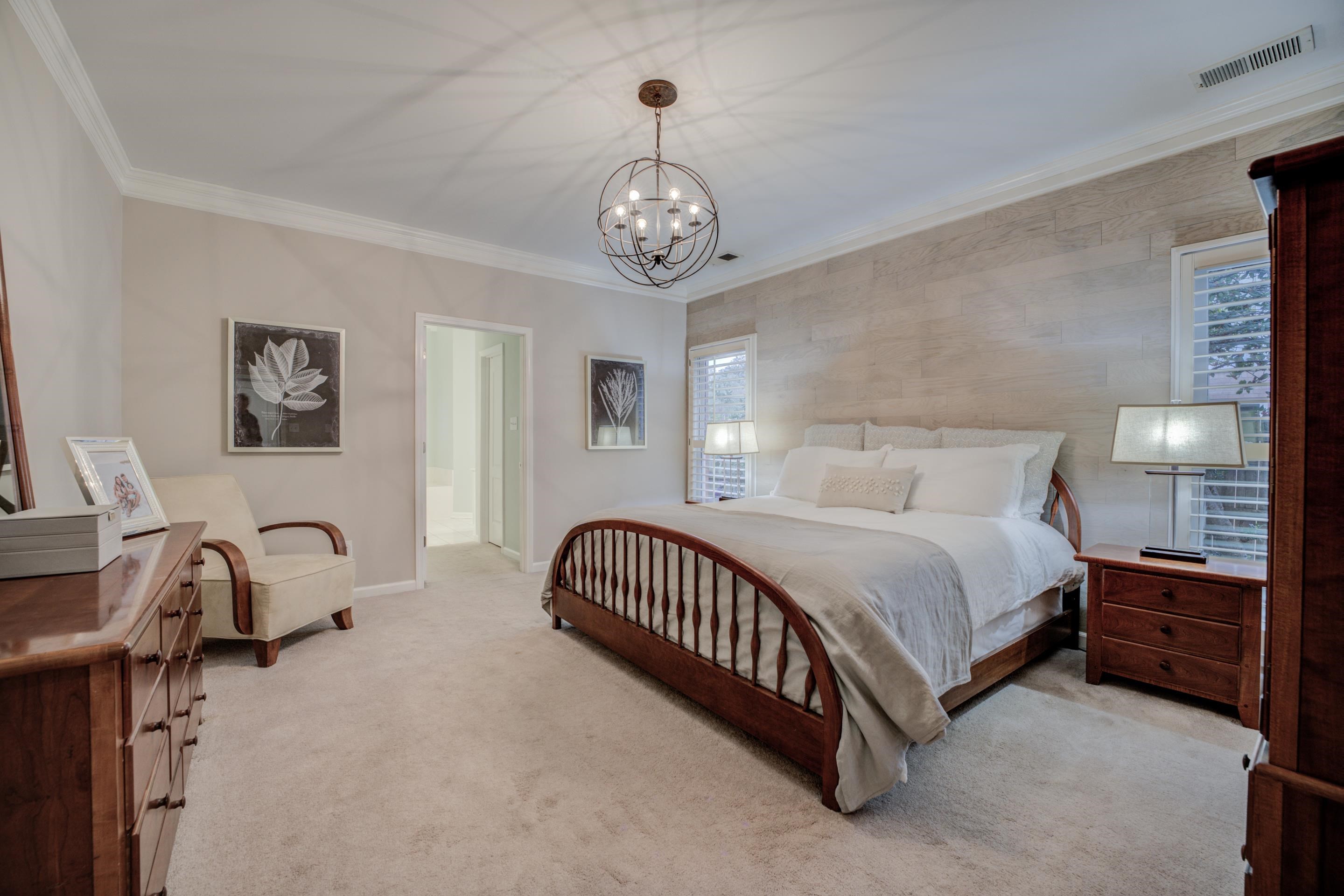 1594 John Ridge Drive Collierville, TN 38017 - Photo 12 of 29 Carpeted bedroom with ensuite bath, a chandelier, and ornamental molding