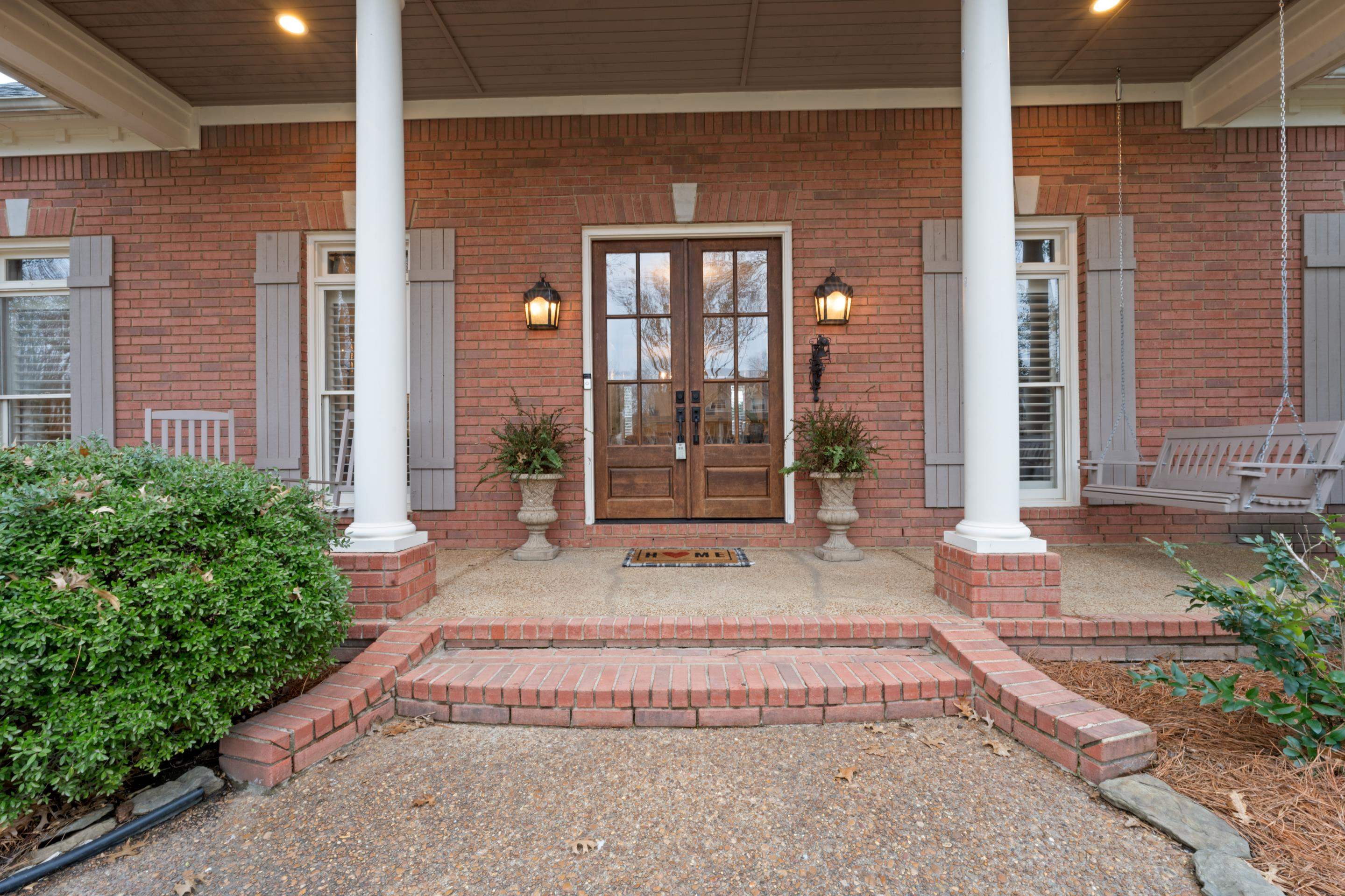 1594 John Ridge Drive Collierville, TN 38017 - Photo 2 of 29 View of exterior entry with a porch and french doors