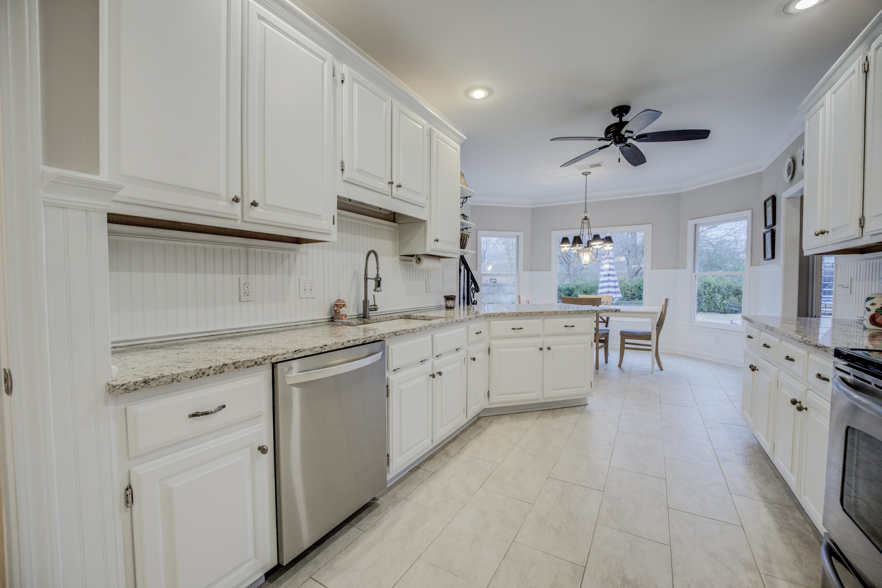 1594 John Ridge Drive Collierville, TN 38017 - Photo 7 of 29 Kitchen with stainless steel dishwasher, white cabinetry, and sink