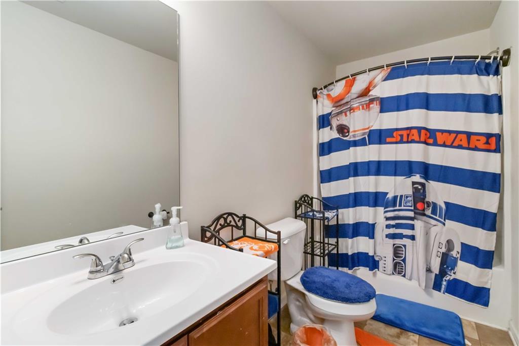 5622 Laurel Ridge Drive Atlanta, GA 30344 - Photo 15 of 23 a bathroom with a sink a toilet and a mirror