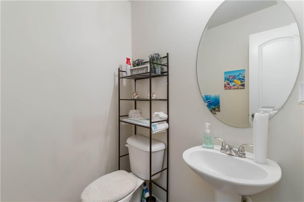 5622 Laurel Ridge Drive Atlanta, GA 30344 - Photo 20 of 23 a bathroom with a toilet sink and mirror