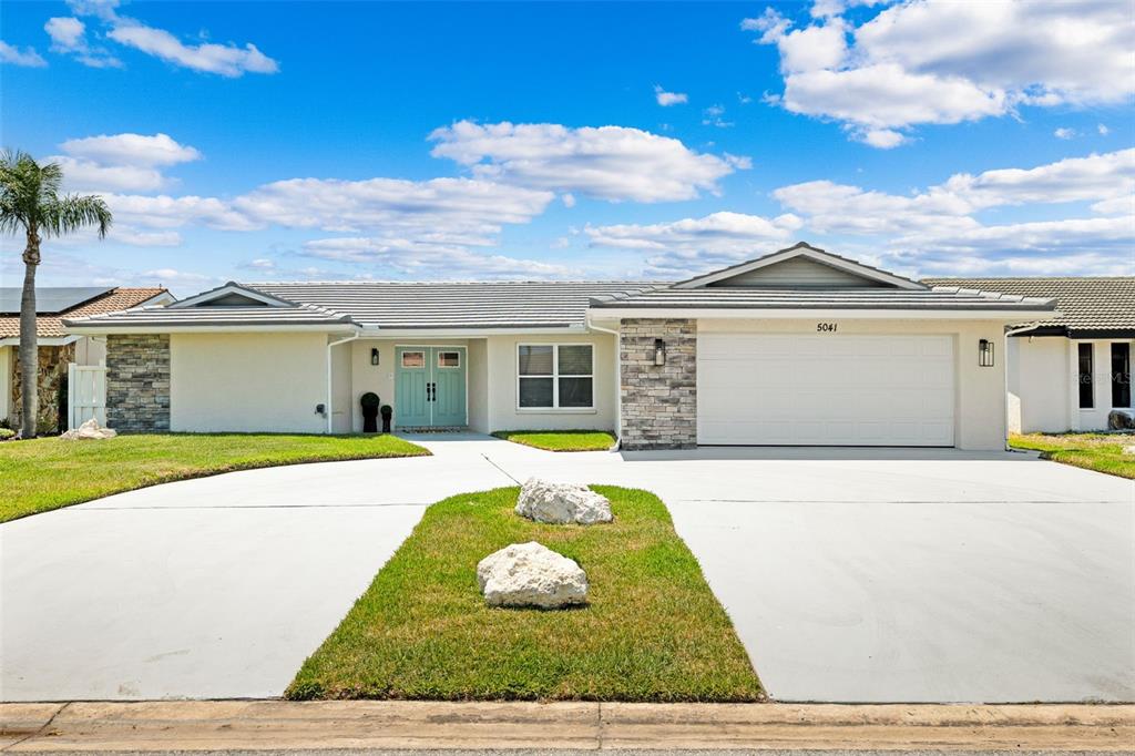 5041 Cabrilla Court New Port Richey, FL 34652 - Photo 1 of 43 a front view of a house with a yard