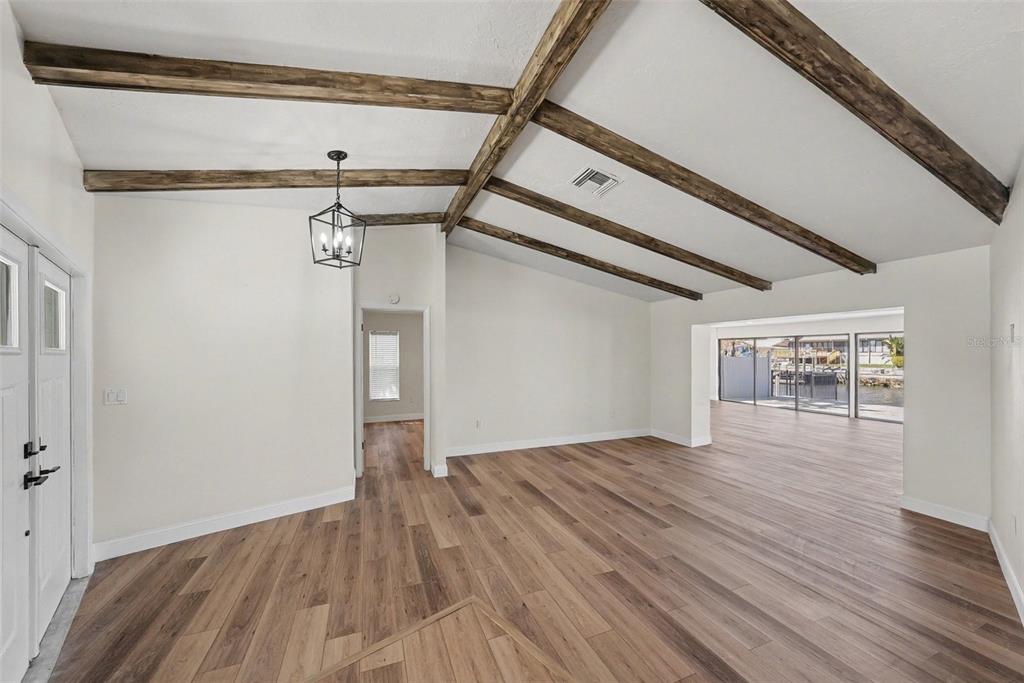 5041 Cabrilla Court New Port Richey, FL 34652 - Photo 11 of 43 a view of empty room with wooden floor