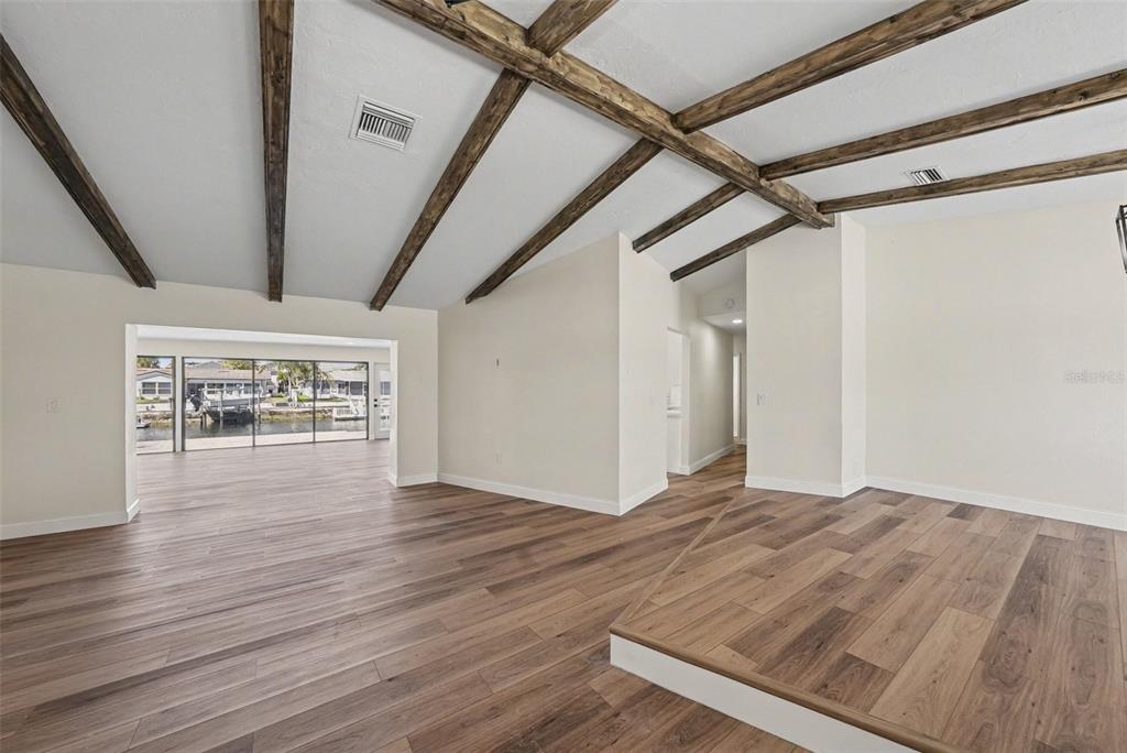 5041 Cabrilla Court New Port Richey, FL 34652 - Photo 14 of 43 a view of an empty room with wooden floor and a window