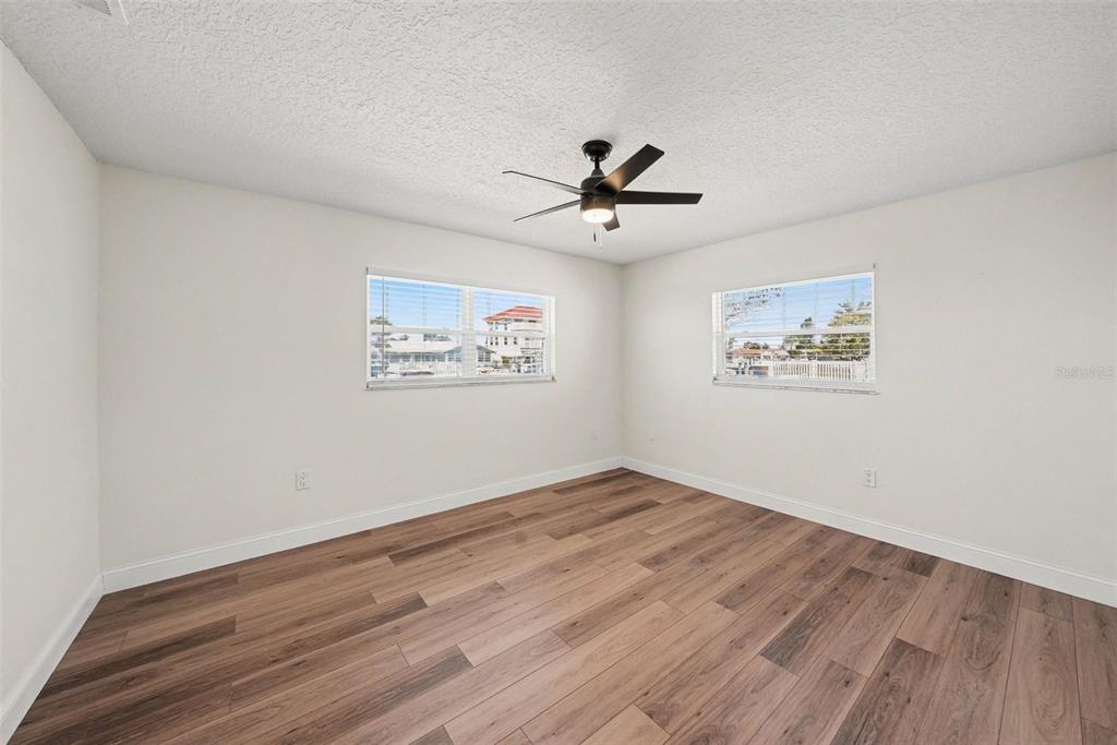 5041 Cabrilla Court New Port Richey, FL 34652 - Photo 29 of 43 a view of empty room with wooden floor