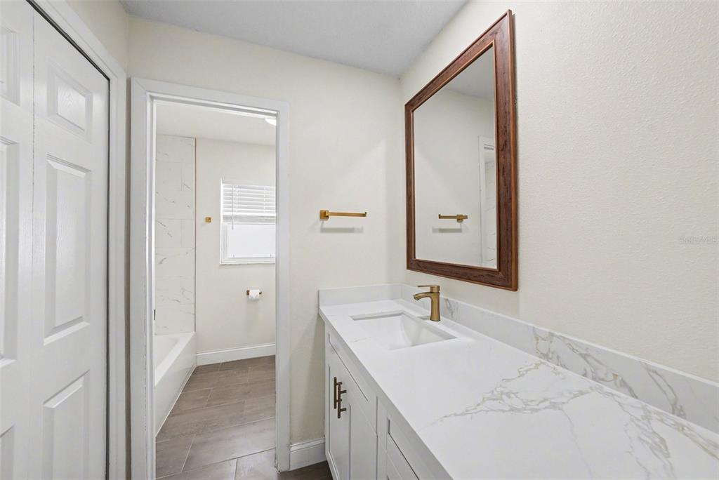 5041 Cabrilla Court New Port Richey, FL 34652 - Photo 30 of 43 a bathroom with a sink and a mirror