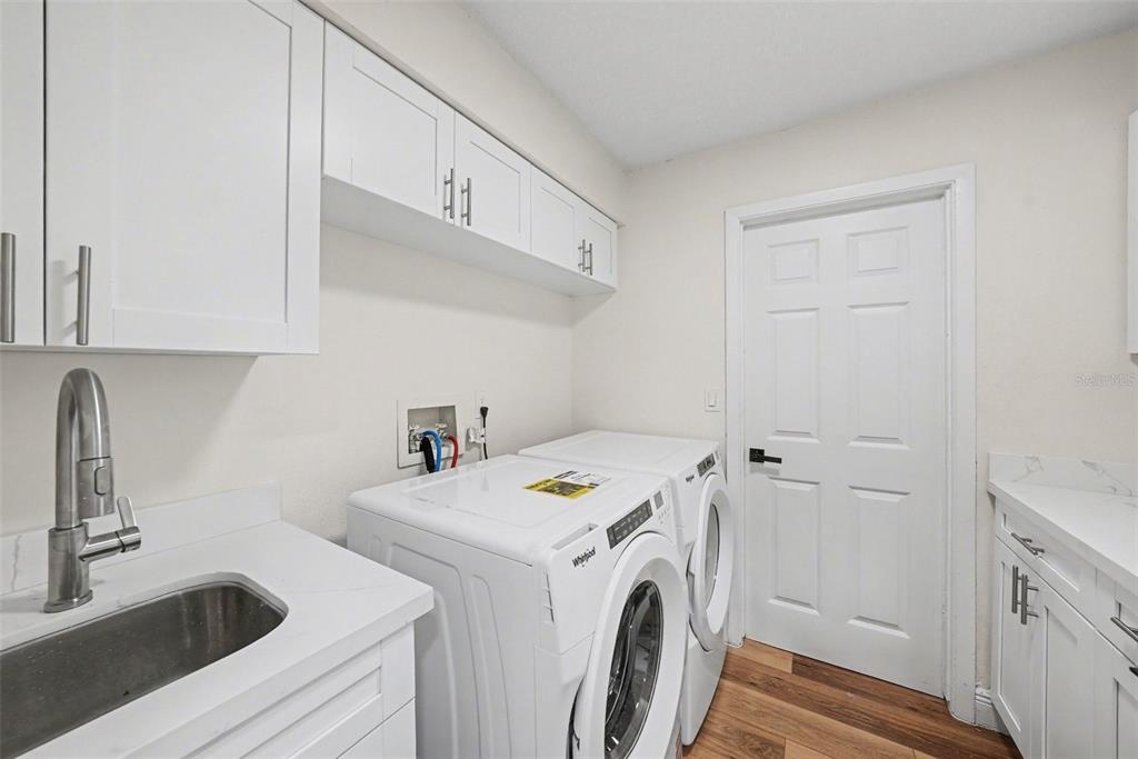 5041 Cabrilla Court New Port Richey, FL 34652 - Photo 33 of 43 a utility room with dryer and washer