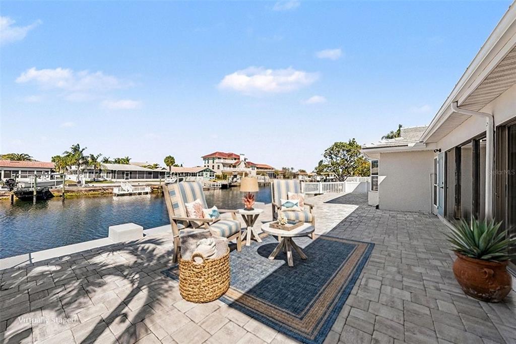 5041 Cabrilla Court New Port Richey, FL 34652 - Photo 35 of 43 a view of a terrace with chairs and wooden floor