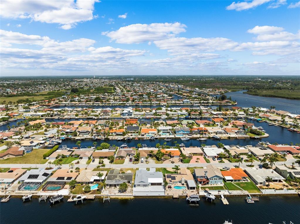 5041 Cabrilla Court New Port Richey, FL 34652 - Photo 43 of 43 an aerial view of residential building with parking space