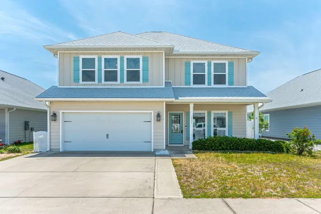 a view of a house with potted plants