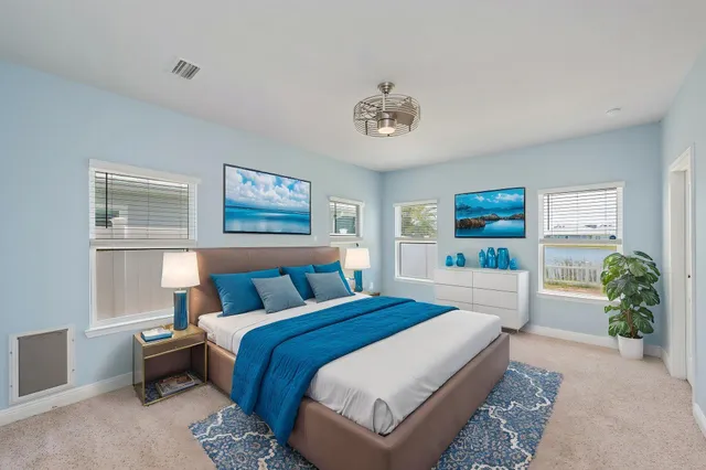 a bathroom with a granite countertop double vanity sink and a mirror