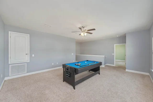 a white bath tub with a shower