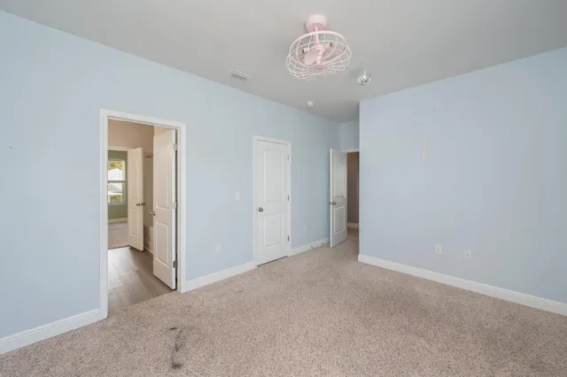 a view of park with a big yard and plants