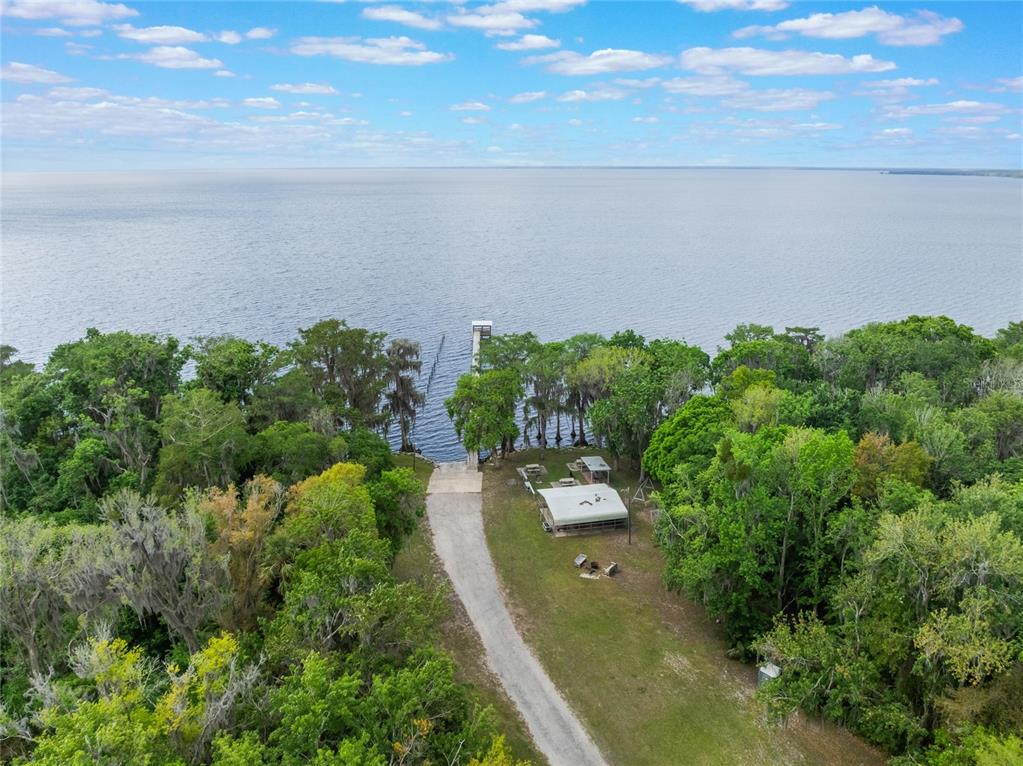 515 Gardenia Avenue Georgetown, FL 32139 - Photo 16 of 25 a view of a lake with a yard