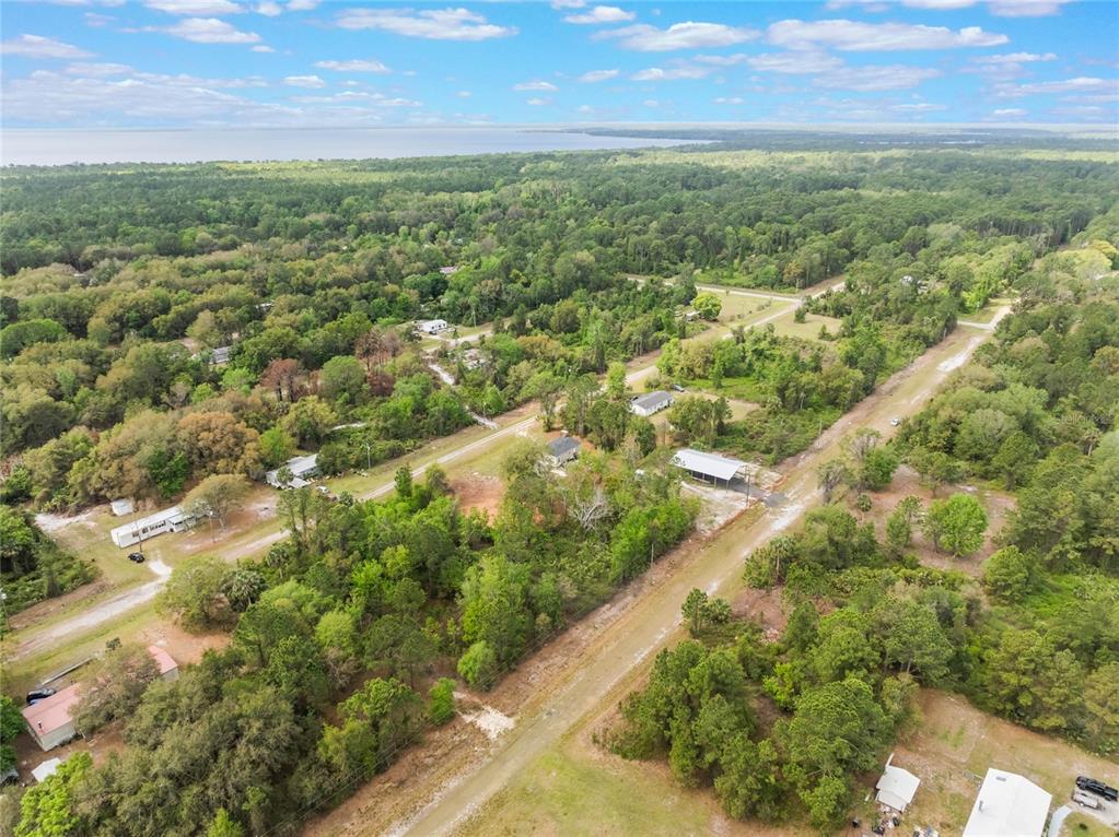 515 Gardenia Avenue Georgetown, FL 32139 - Photo 5 of 25 a view of a city with lush green forest