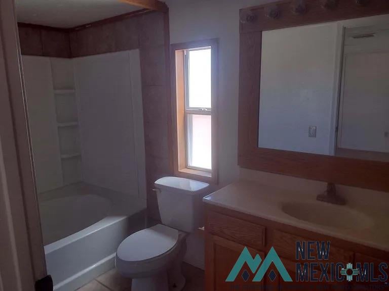 77 Northwest Bookout Road Tularosa, NM 88352 - Photo 8 of 33 Bathroom with vanity and shower / bathtub combination