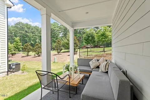 a living room with furniture and a yard