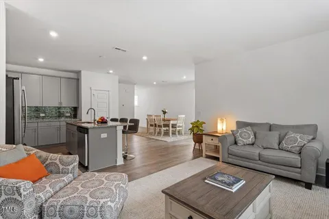 a living room with furniture and a table