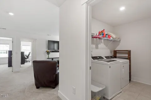a view of a living room with furniture and a flat screen tv