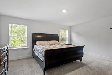 a bedroom with a bed and furniture