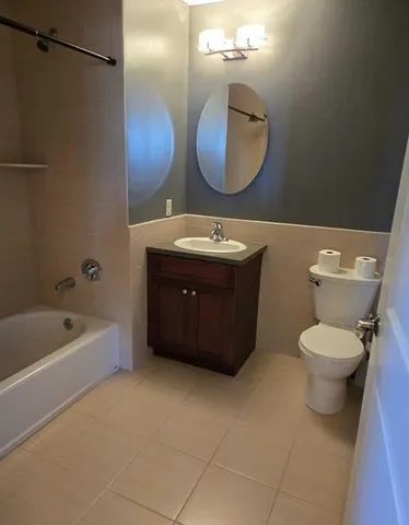 a bathroom with a sink a toilet and bathtub