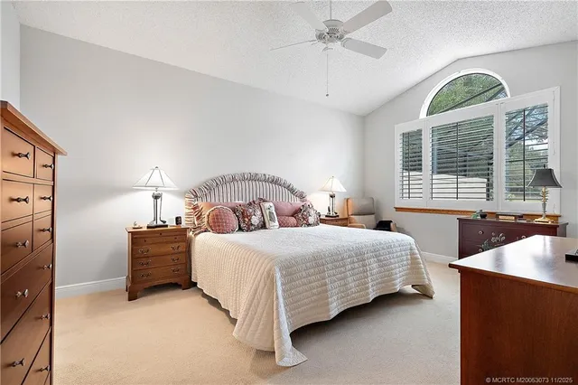 a kitchen with granite countertop a stove and a refrigerator