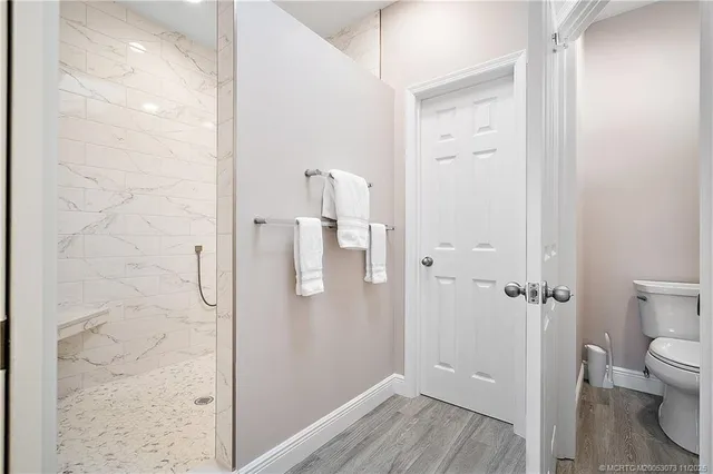 a view of a dining room with furniture and window