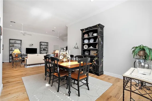 a workspace with wooden floor and furniture