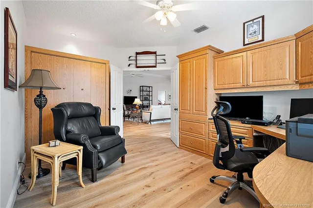 a bedroom with a bed and a table