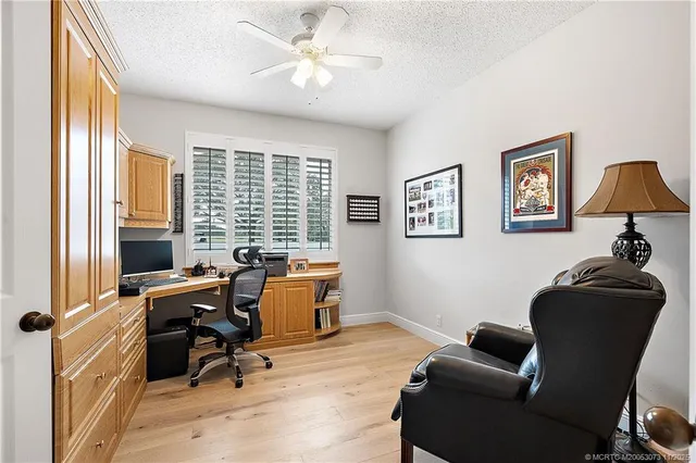 a bed room with a bed and a chair