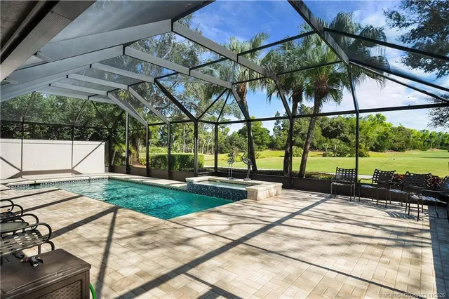 an aerial view of a residential houses with outdoor space