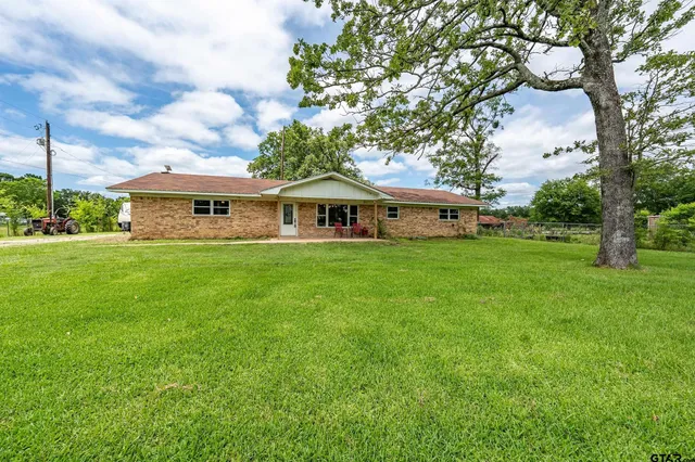 a view of a house with a big yard