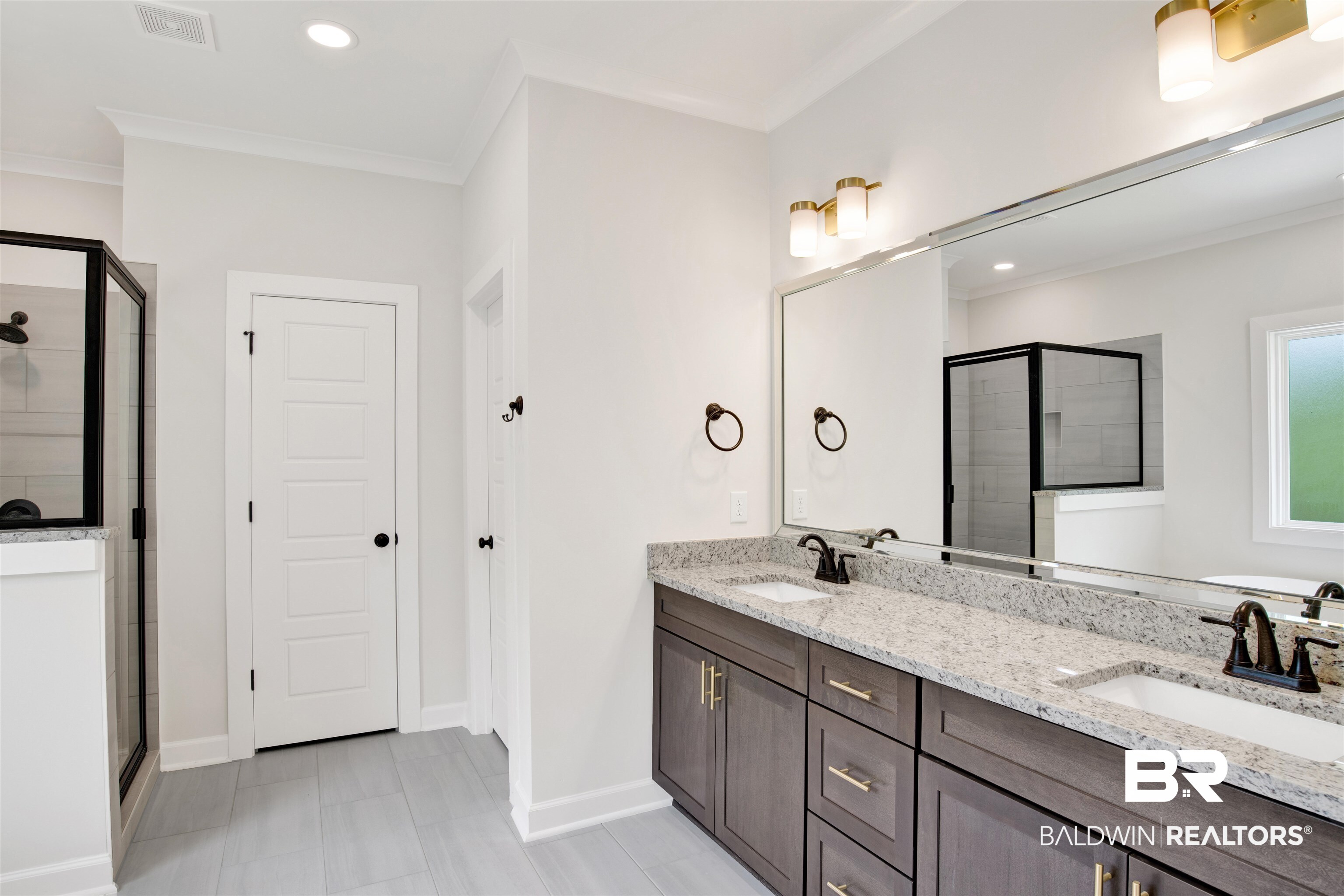 8760 Floyd Crabtree Way Semmes, AL 36575 - Photo 15 of 34 Dual vanity with granite countertops, undermount sinks, and matte black faucets