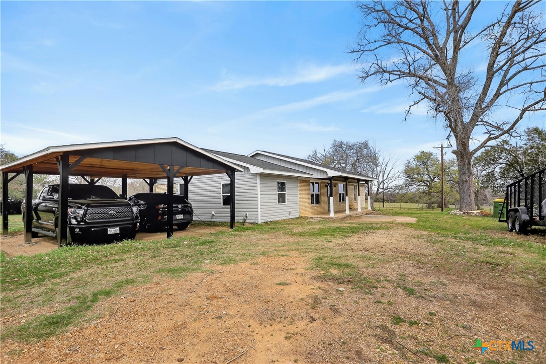 2539 County Road 347 Loop Gause, TX 77857 - Photo 1 of 25 a view of a house with a big yard and large trees