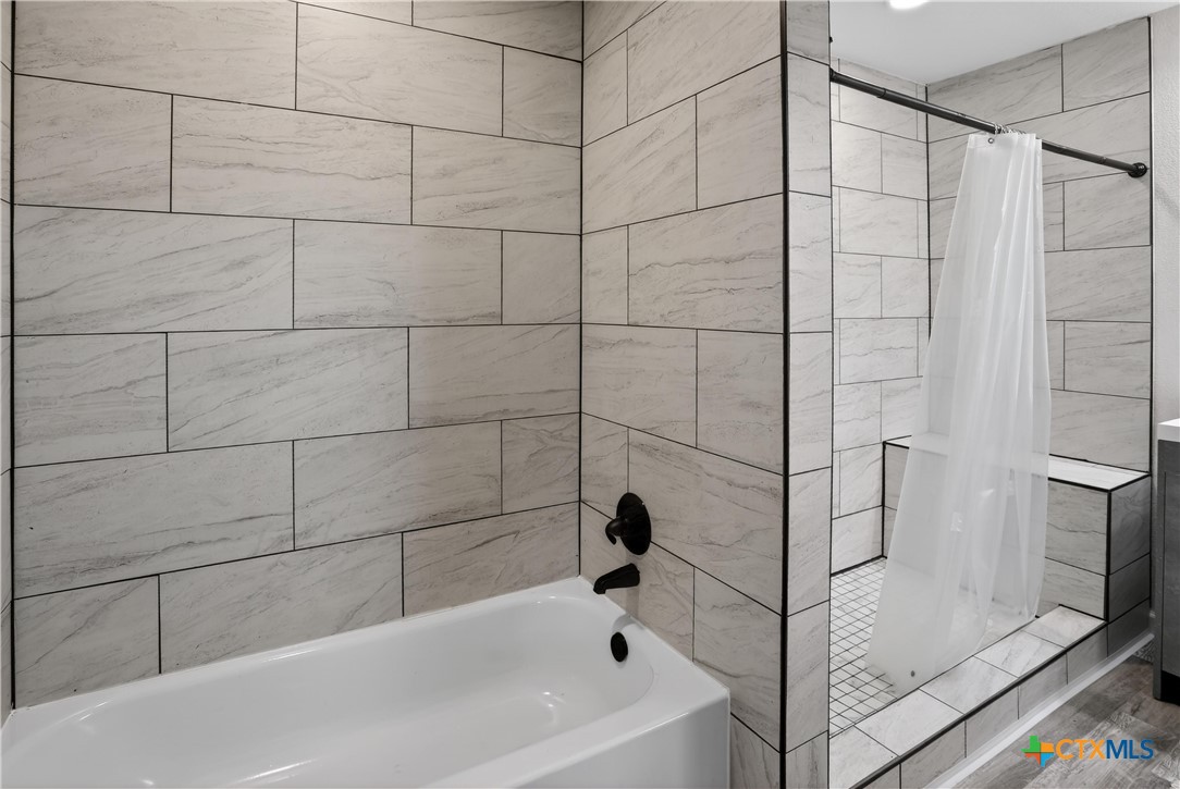 2539 County Road 347 Loop Gause, TX 77857 - Photo 12 of 25 a bathroom with a bathtub