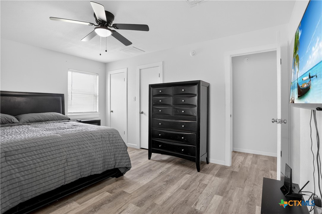 2539 County Road 347 Loop Gause, TX 77857 - Photo 13 of 25 a bedroom with a bed and a ceiling fan