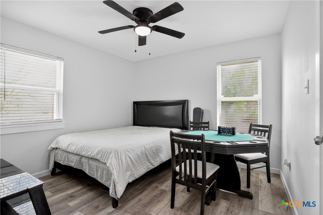 2539 County Road 347 Loop Gause, TX 77857 - Photo 16 of 25 a bedroom with a bed and a table