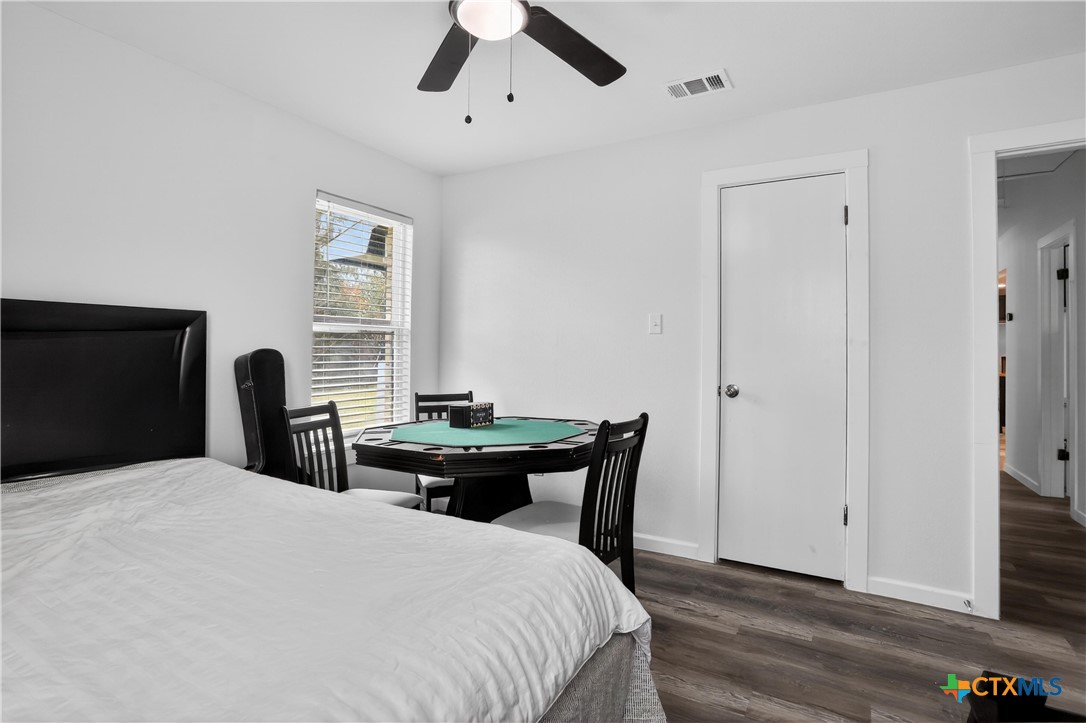 2539 County Road 347 Loop Gause, TX 77857 - Photo 17 of 25 a bedroom with a bed and a potted plant