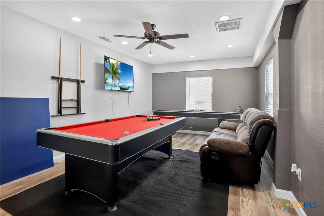 2539 County Road 347 Loop Gause, TX 77857 - Photo 20 of 25 a room with pool table a projector and a ceiling fan