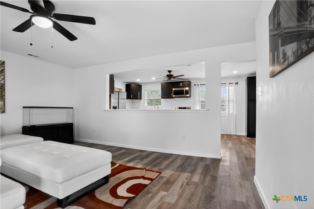 2539 County Road 347 Loop Gause, TX 77857 - Photo 2 of 25 a bedroom with a bed and a view of kitchen