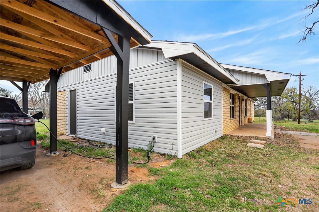2539 County Road 347 Loop Gause, TX 77857 - Photo 24 of 25 a view of a house with a backyard