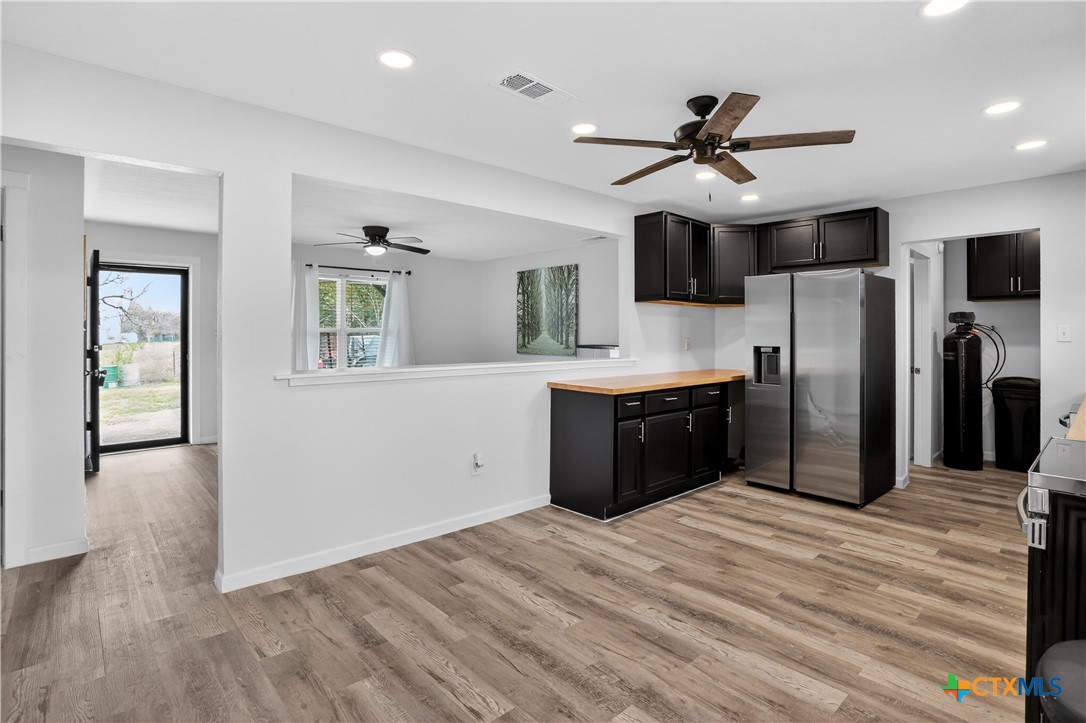 2539 County Road 347 Loop Gause, TX 77857 - Photo 6 of 25 a kitchen with stainless steel appliances a refrigerator and a sink