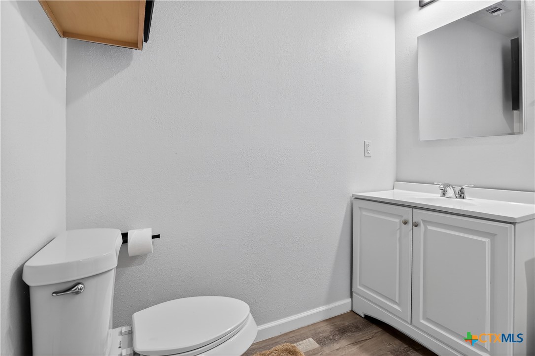 2539 County Road 347 Loop Gause, TX 77857 - Photo 10 of 25 a white toilet sitting next to a bathroom sink