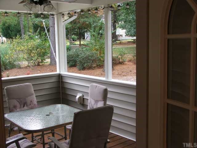 2720 Quail Point Drive Raleigh, NC 27603 - Photo 8 of 12 a view of a chair and table in the balcony
