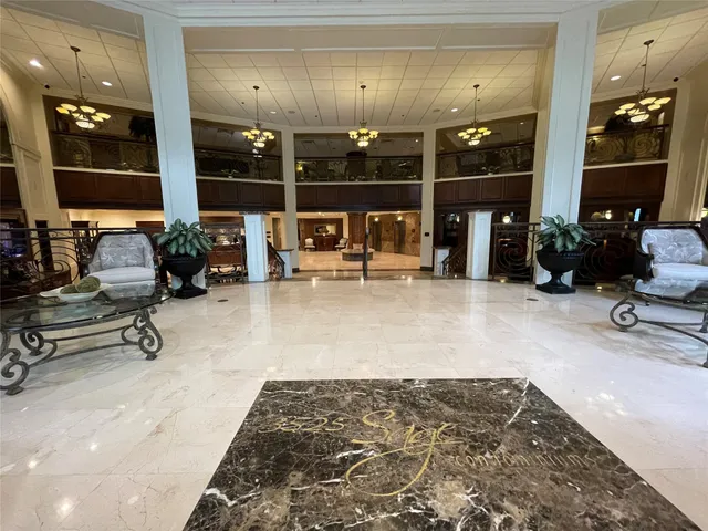 a view of a lobby with black carpet