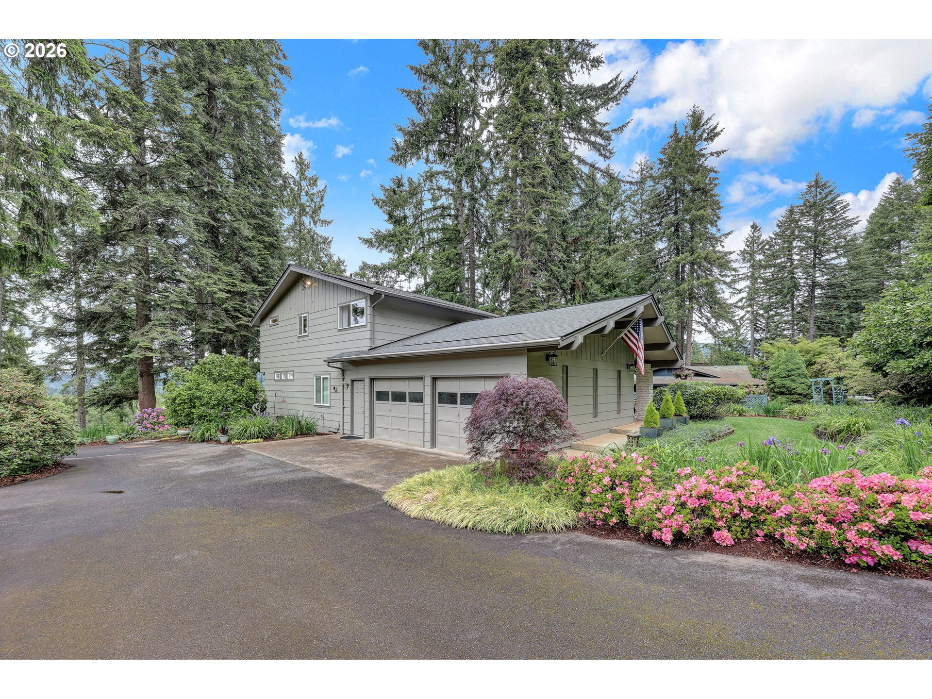 88108 Tiki Lane Springfield, OR 97478 - Photo 5 of 48 a view of a house with a yard and garden